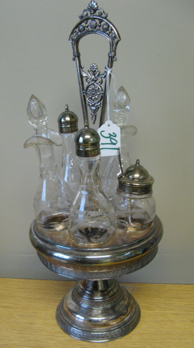 Appraisal: AN AMERICAN SILVER PLATED CASTOR SET having bottles fitted in