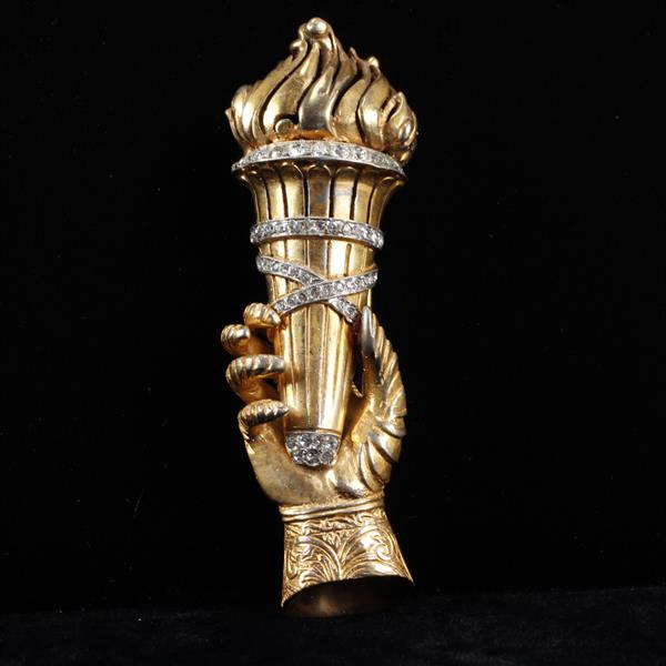 Appraisal: R DeRosa hand holding torch gilt and pave fur clip