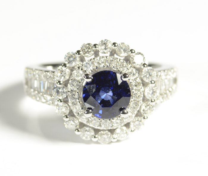 Appraisal: SAPPHIRE DIAMOND AND FOURTEEN KARAT WHITE GOLD RING featuring a