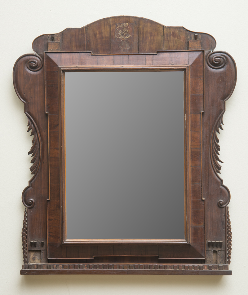 Appraisal: CONTINENTAL BAROQUE WALNUT MIRROR The rectangular plate within inner border