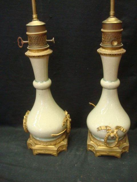 Appraisal: Pair of Bronze Mounted Asian Porcelain Lamps Great quality bronze