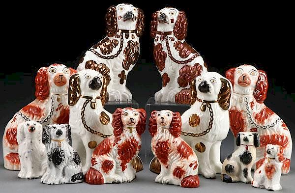 Appraisal: A COLLECTION OF TWELVE STAFFORDSHIRE SPANIELS A COLLECTION OF TWELVE