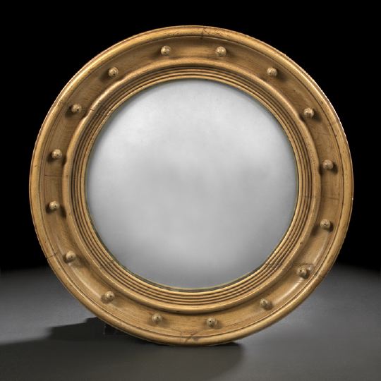 Appraisal: Regency-Style Waxed Wood Looking Glass the circular mirror plate surmounted