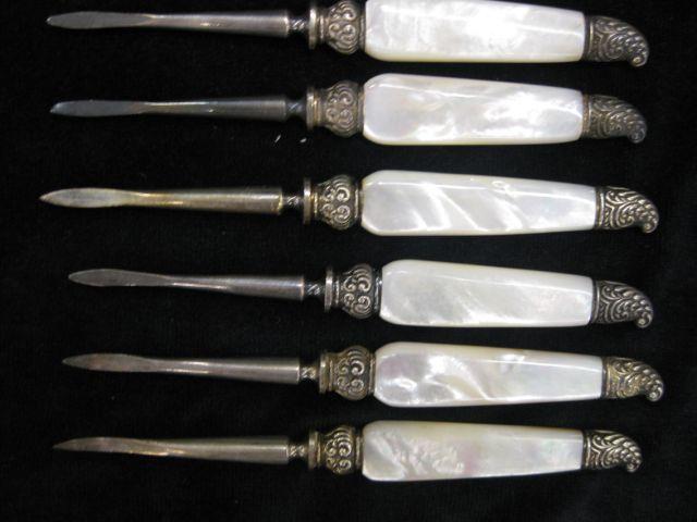 Appraisal: Victorian Nut Picks mother-of-pearl handles with ornate sterling trim