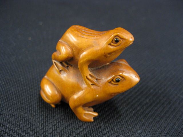 Appraisal: Carved Wood Netsuke of Two frogs onyx eyes signed