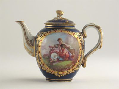 Appraisal: A small S vres-style teapot and cover each side painted