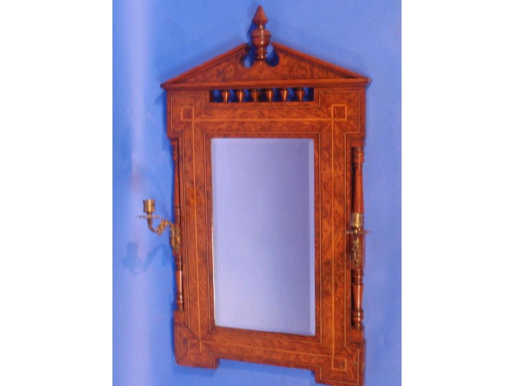 Appraisal: A burr walnut wall mirror with inlaid decoration turned columns