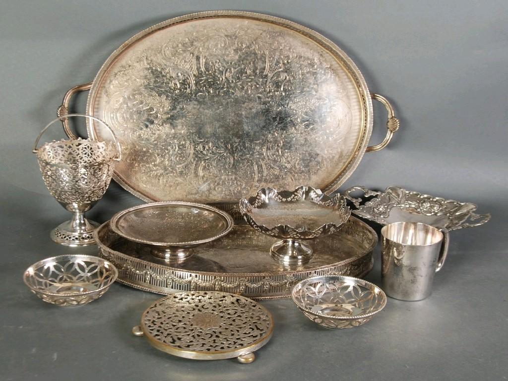 Appraisal: TWO ELECTROPLATED OVAL GALLERIED TRAYS with engraved foliate scroll centres