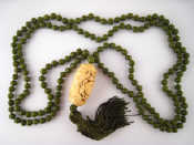 Appraisal: A Chinese green hardstone two row necklace approx cm long