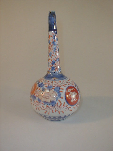 Appraisal: A Meiji period Imari bottle vase painted in typical palette