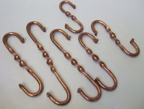 Appraisal: A group of six copper game hooks with twisted decoration