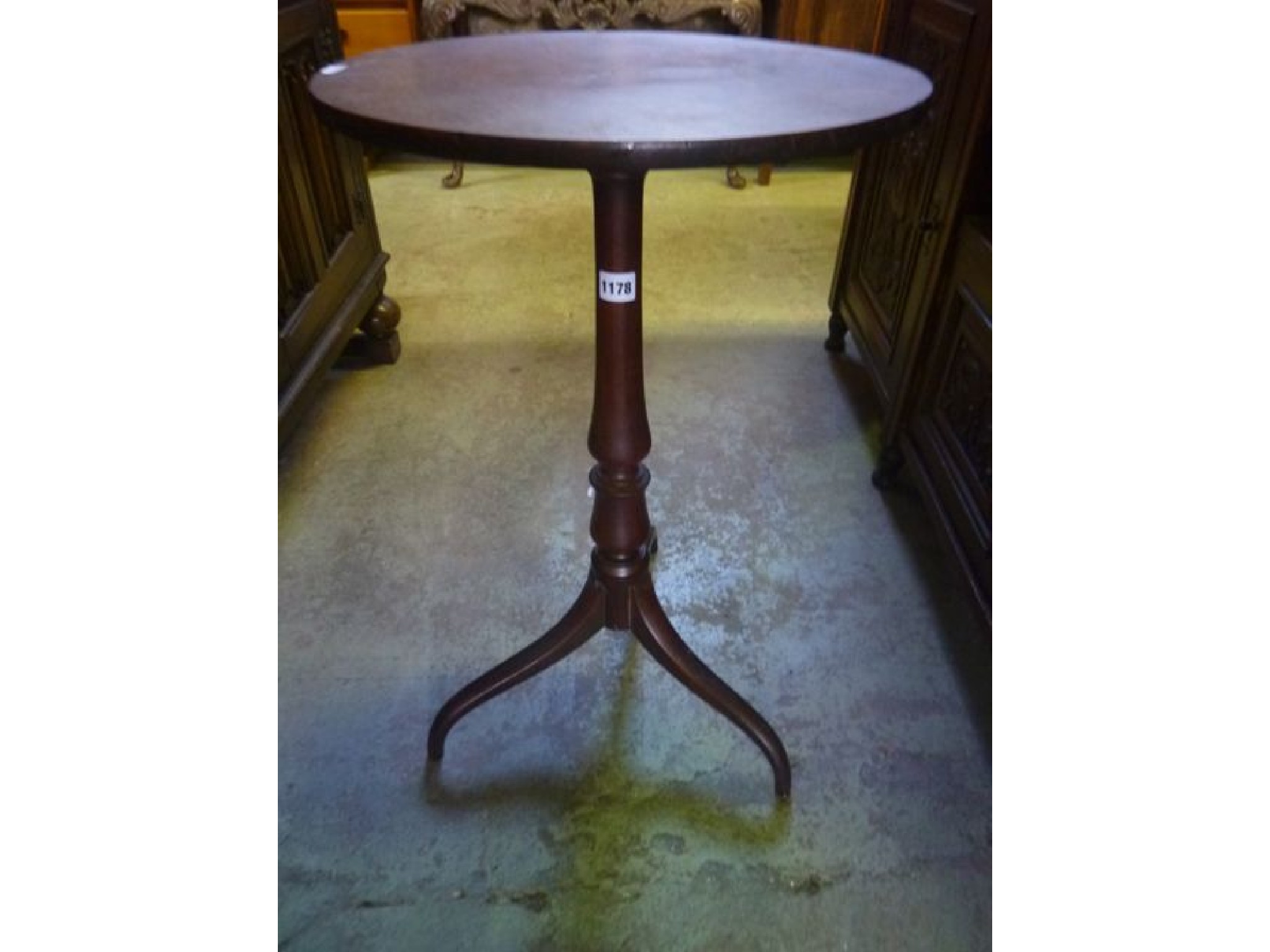 Appraisal: A th century mahogany occasional table of circular form raised