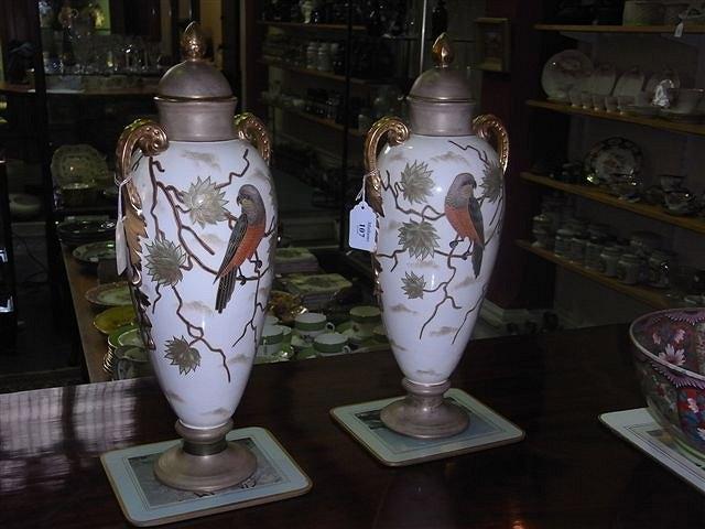 Appraisal: A PAIR OF AUSTRIAN POTTERY VASES with flower decoration and