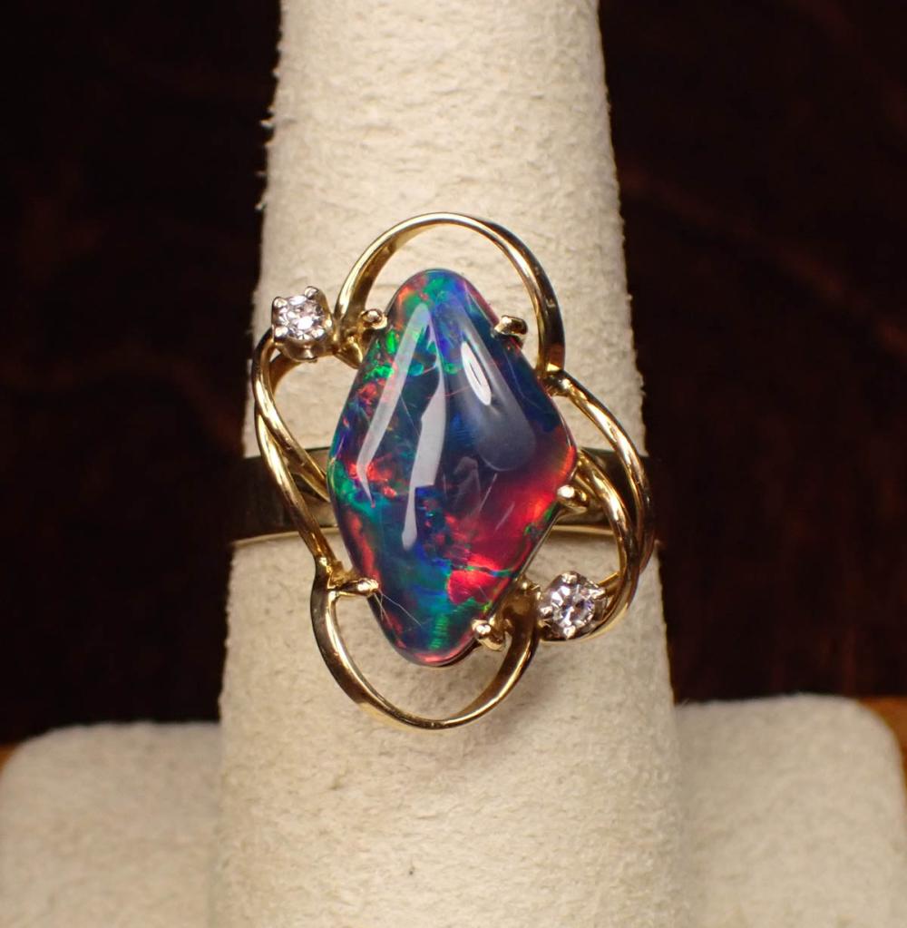 Appraisal: BLACK OPAL TRIPLET AND EIGHTEEN KARAT GOLD RING The yellow