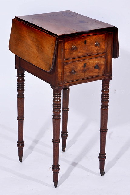 Appraisal: A GEORGE IV MAHOGANY DROP LEAF WORK TABLE fitted drawers