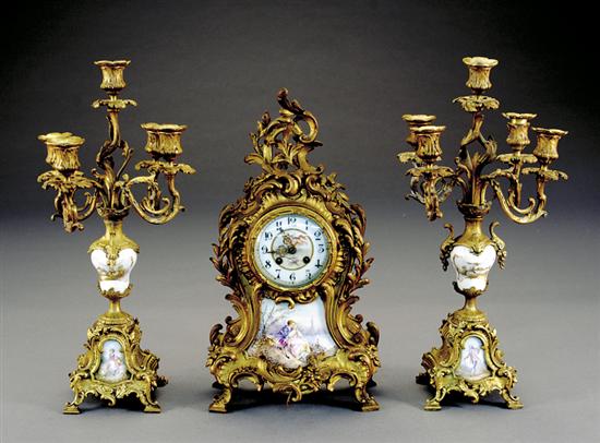 Appraisal: Rococo style clock garniture by Marti circa gilt cast-metal mounted