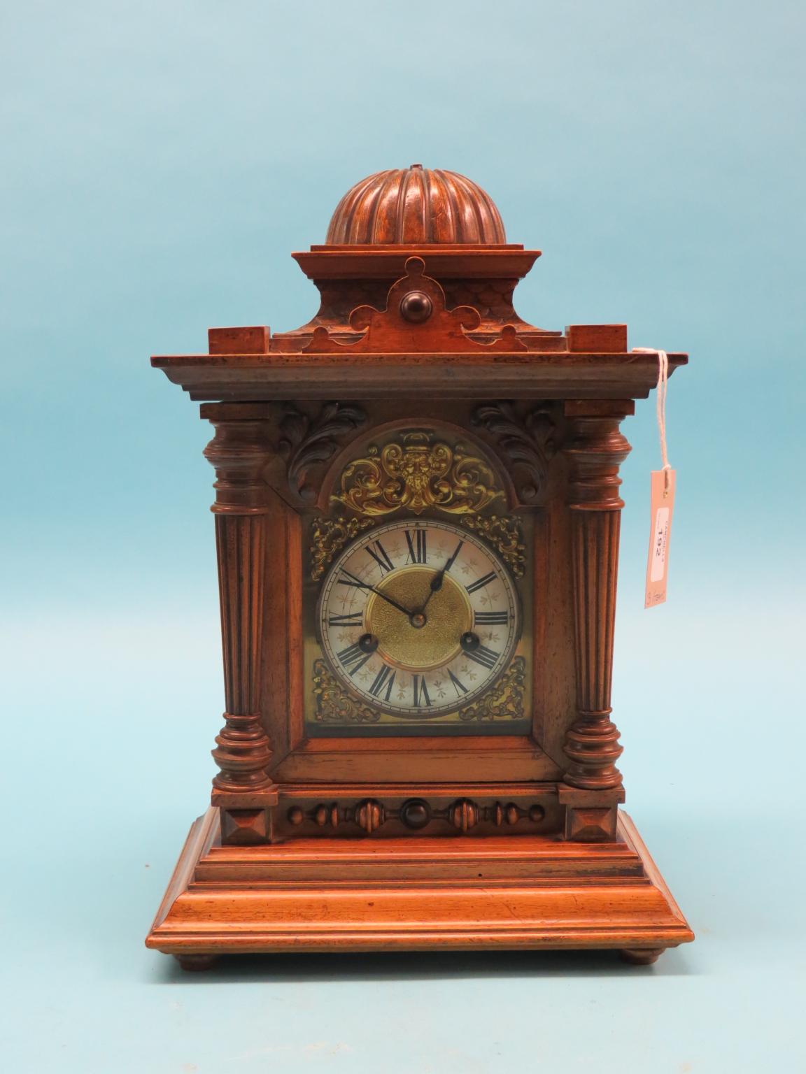 Appraisal: A Victorian walnut bracket clock architectural form with arched brass