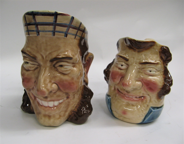 Appraisal: TWO FRENCH MAJOLICA SARREGUEMINES CHARACTER JUGS including a Scottish faced