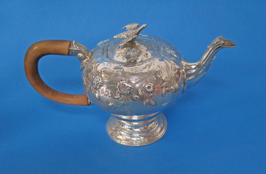 Appraisal: A GEORGE III TEAPOT of circular tapering form the hinged