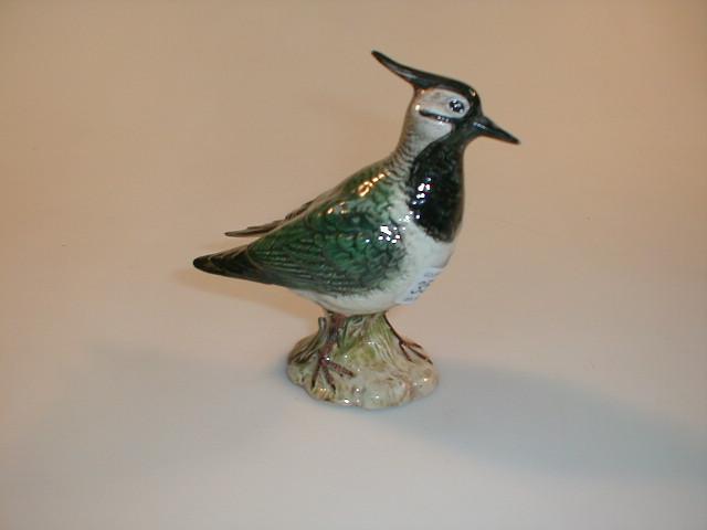 Appraisal: A Beswick lapwing in green black and buff glazes model