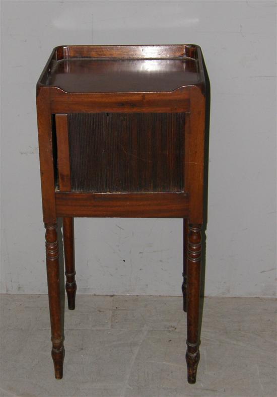 Appraisal: George III mahogany pot cupboard with tambour front raised on