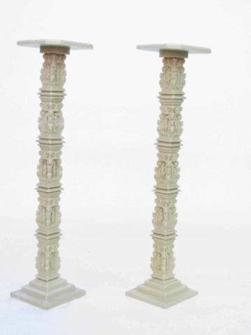 Appraisal: A pair of figural carved classic style pedestals resin depicting