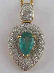 Appraisal: An carat gold pave set diamond and pear shaped emerald