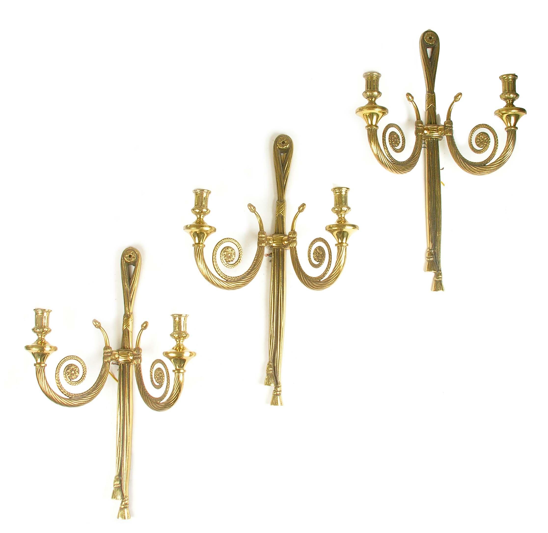 Appraisal: A set of three gilt brass twin branch wall lights