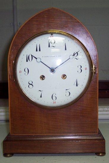 Appraisal: An Edwardian mahogany mantel clock the arch top case with