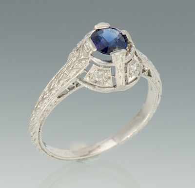 Appraisal: A Platinum Sapphire and Diamond Ring Platinum filigree mounting features