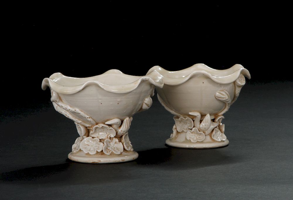 Appraisal: Pair Ding Carved 'Lotus' Cups Each of deep curved sides