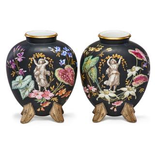 Appraisal: PAIR OF PARIS PORCELAIN VASES Floral decoration on ebonized ground