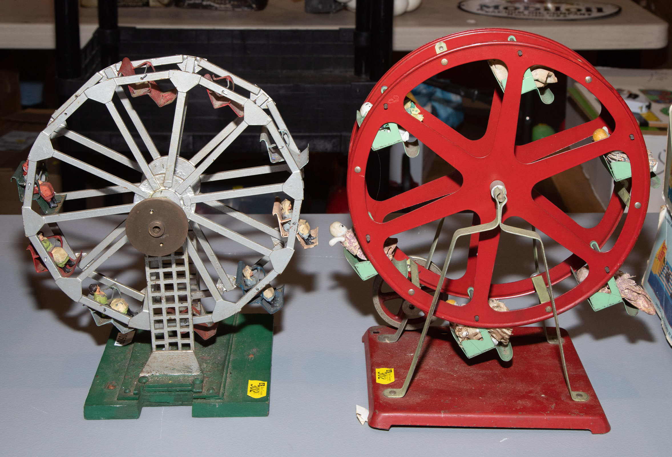 Appraisal: TWO STEAM TOY FERRIS WHEELS One ferris wheel with porcelain