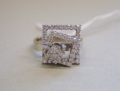 Appraisal: A diamond set dress ring designed as three square stepped