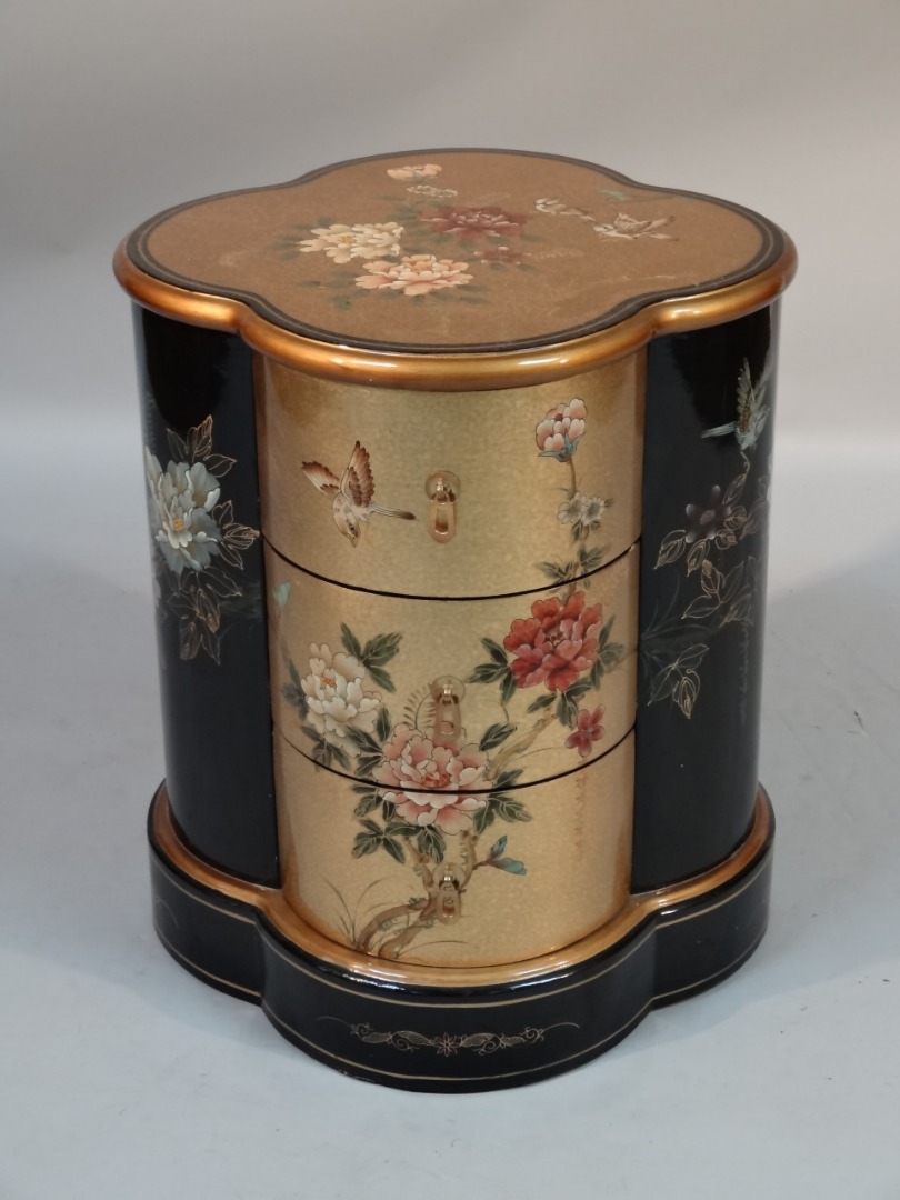 Appraisal: A thC Chinese lacquer finish and giltwood cabinet with a