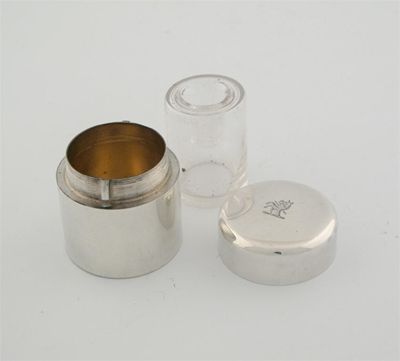 Appraisal: An Edwardian travelling inkwell of plain cylindrical form with a