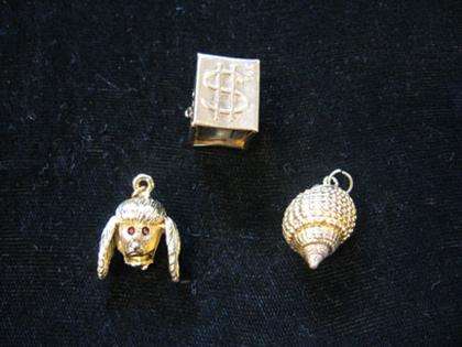 Appraisal: Group of three charms Shell charm poodle head charm with