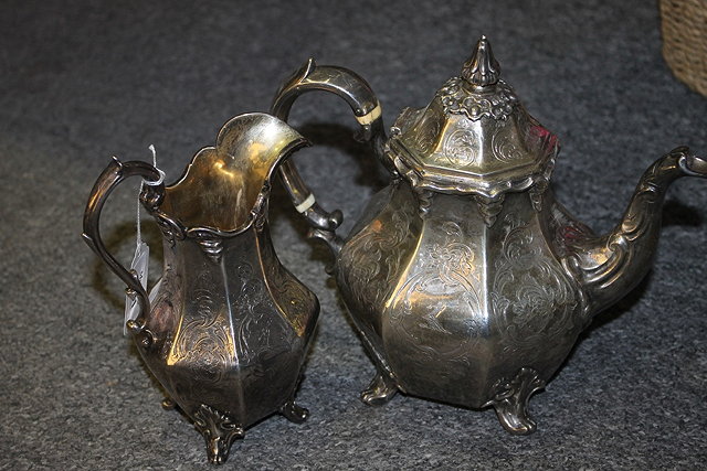 Appraisal: A SILVER TEAPOT and a milk jug of octagonal baluster