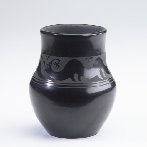 Appraisal: San Ildefonso black vessel with stylized lizard monster design excellent