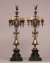 Appraisal: A Pair of Egyptian Revival Candelabra Ornate brass five light