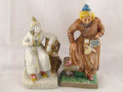 Appraisal: A pair of Russian pottery figures of a Kirghiz couple