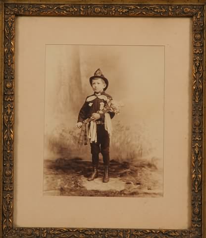 Appraisal: Photograph showing young boy dressed in uniform of company No