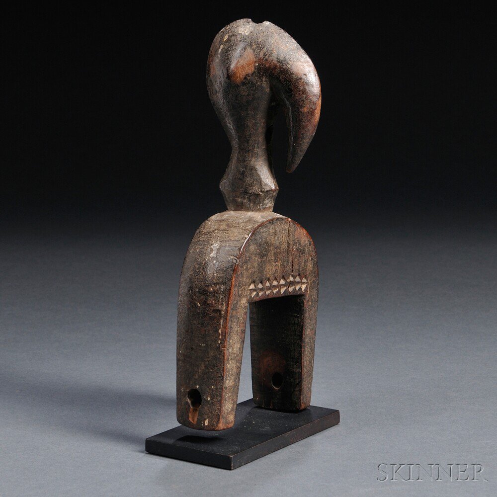 Appraisal: Senufo Bird Head Heddle Pulley includes stand ht in Estimate