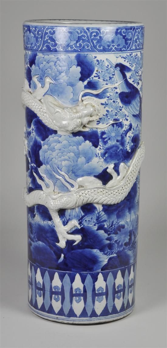 Appraisal: Blue White Oriental Umbrella Stand Circa Applied white stoneware dragon