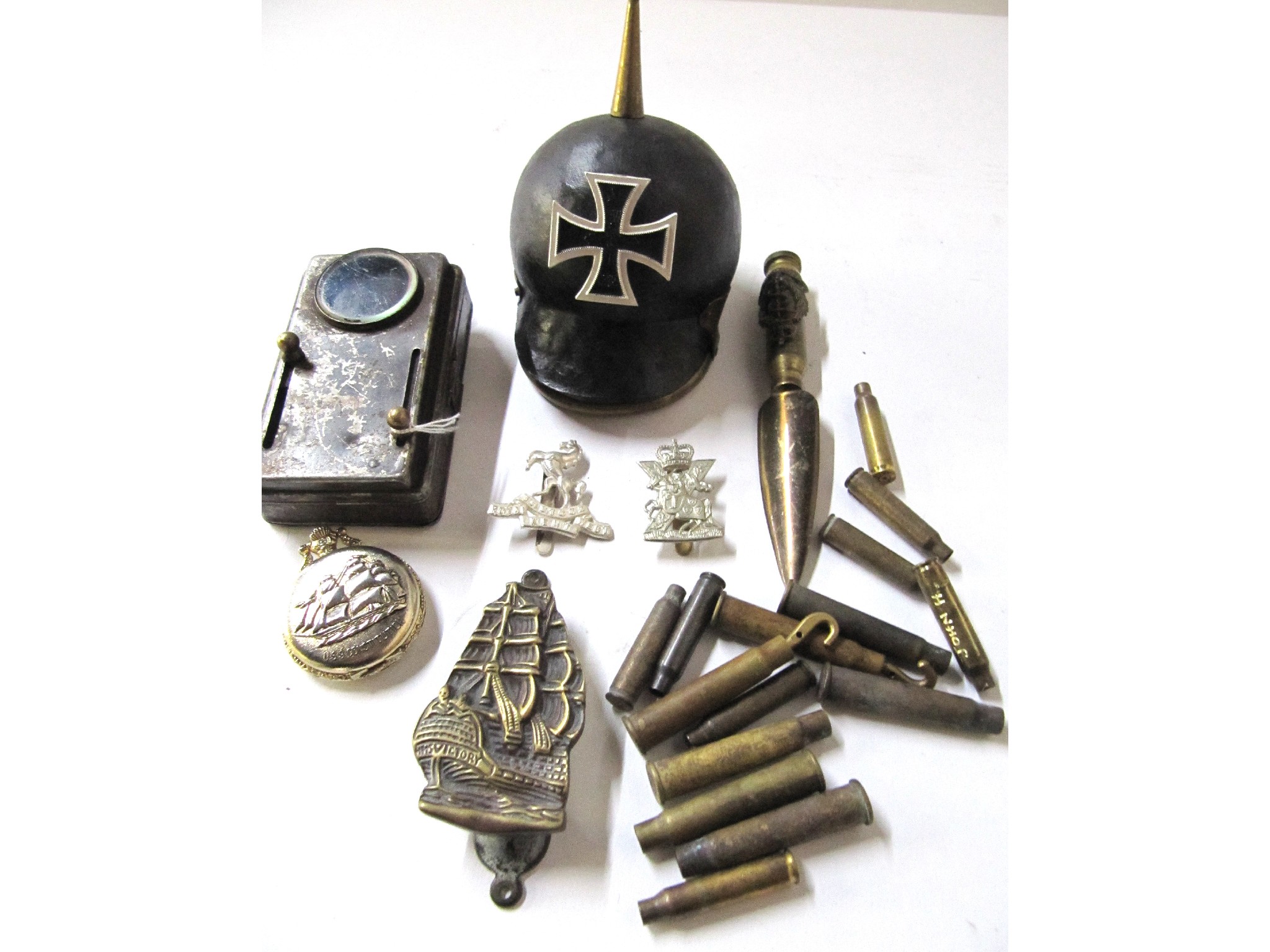 Appraisal: A tray lot of militaria model pickelhaub mounted with an