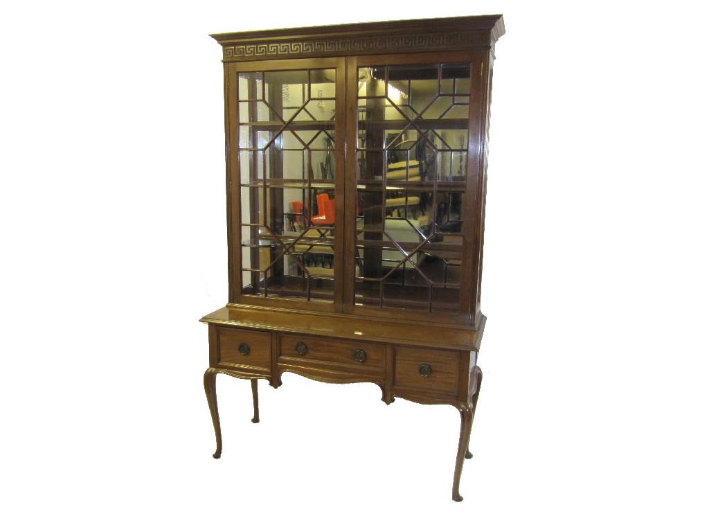 Appraisal: An Edwardian mahogany display cabinet the pediment bearing a carved