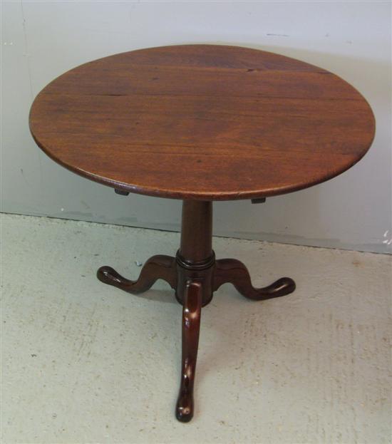 Appraisal: George III walnut tilt top table with column support to