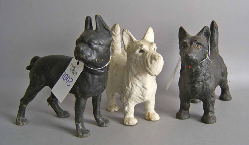 Appraisal: Three cast iron dog doorstops ca