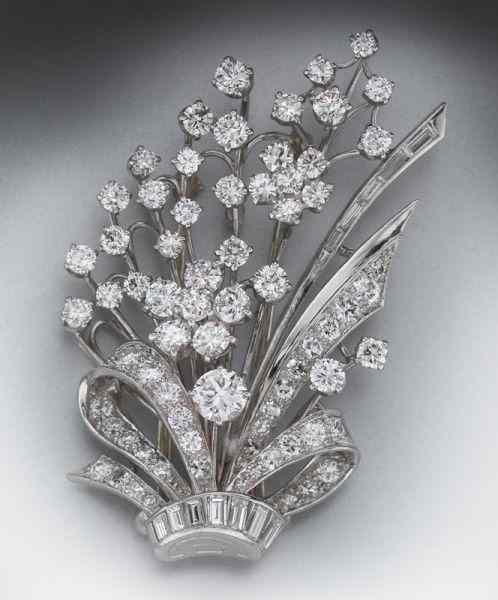 Appraisal: Art Deco platinum and diamond floral spray broochhaving straight baguette