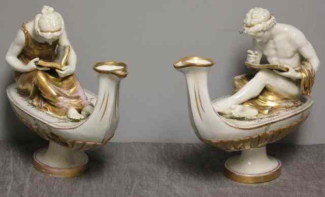 Appraisal: Pair of Porcelain Aladdin Type Figures Classical figures seated on